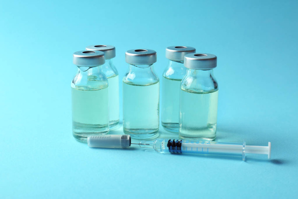 Vaccine in vials with syringe   - Φωτογραφία, εικόνα