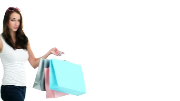 Sexy woman holding shopping bags - Filmati, video