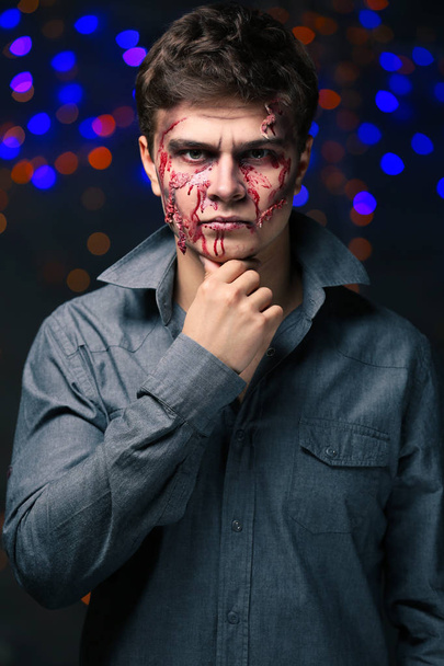 Young man with Halloween makeup at party - Fotoğraf, Görsel