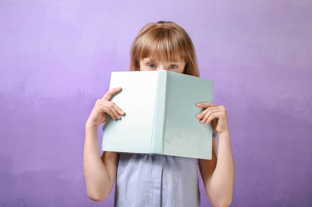 Pretty little girl with book - Foto, afbeelding