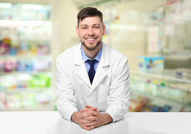 Male pharmacist at work - Фото, изображение