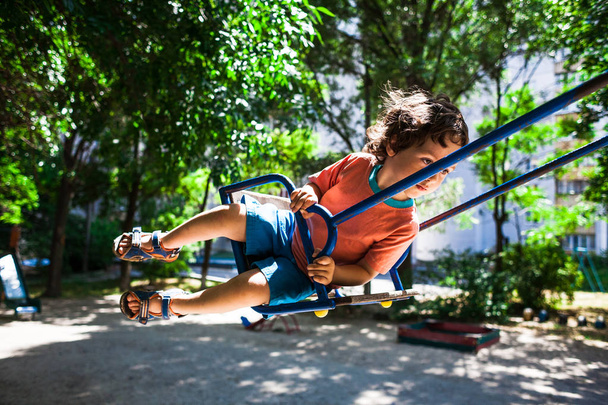 child is having fun on the swing. - Fotoğraf, Görsel