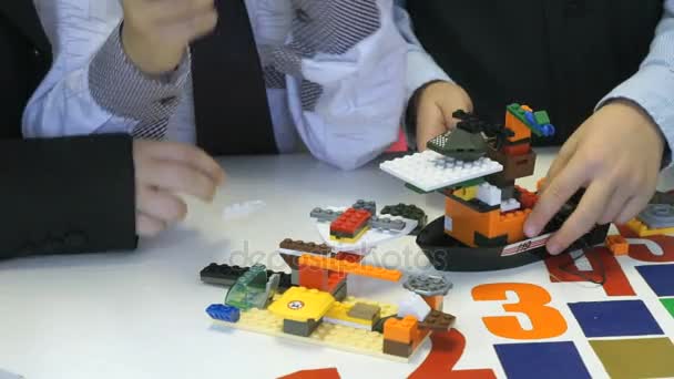 Children collecting intellectual designer.Close-up - Video