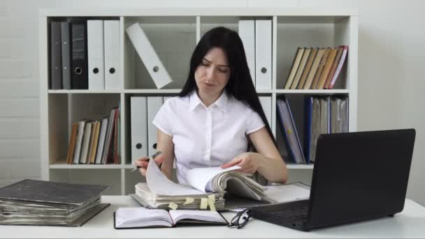 Woman tired of paperwork in the office - Footage, Video