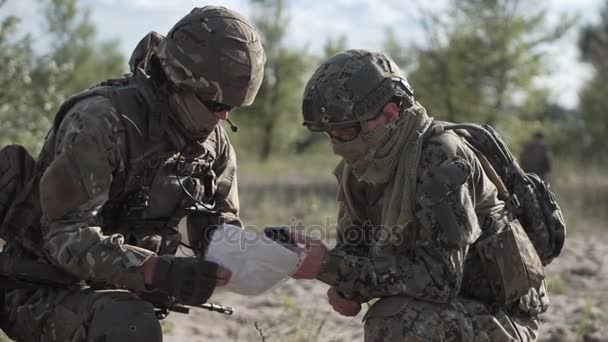 Military people navigating on battlefield - Footage, Video