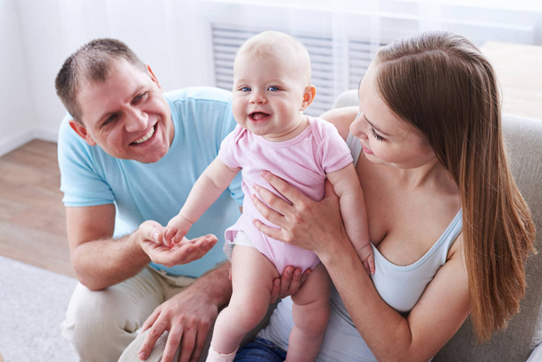 Happy parents spending time with their little girl - Photo, image