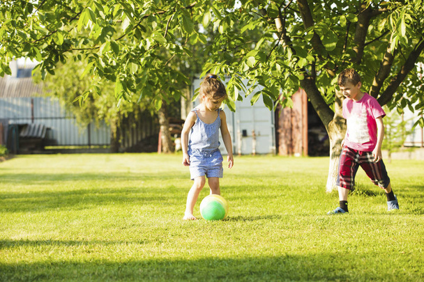 Children with a ball - Foto, imagen