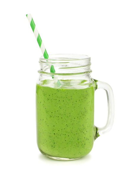 Healthy green smoothie with straw in a jar mug isolated on white - Fotoğraf, Görsel