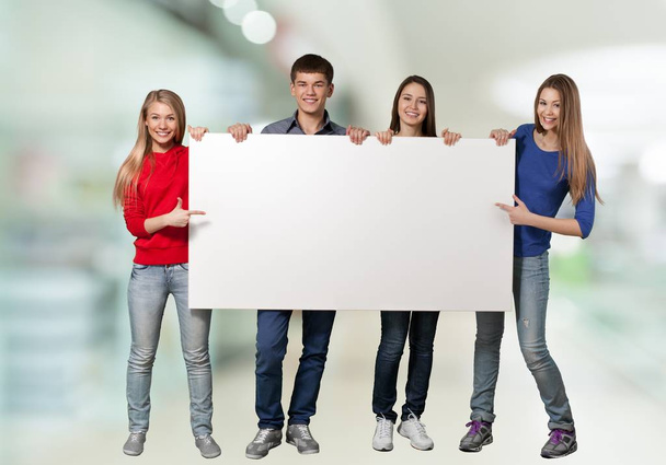students with blank card - Fotó, kép