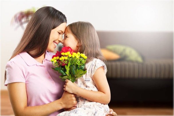 mother and daughter with flowers - Fotó, kép