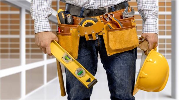 Worker with a tool belt - Foto, Imagem