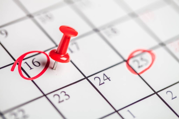 Embroidered  pin on a calendar on the 16th - 写真・画像