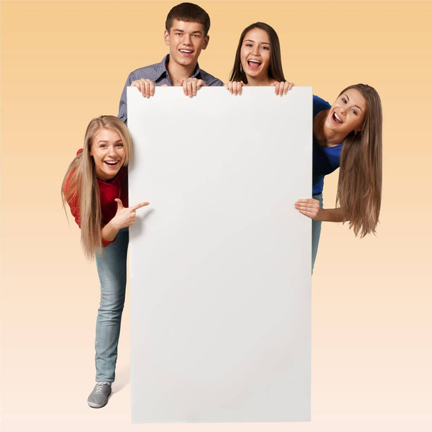 teens holding blank banner  - Fotografie, Obrázek