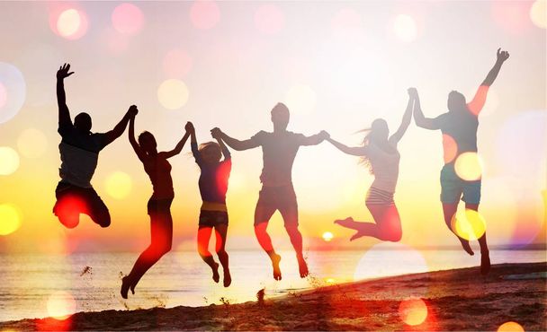 Friends jumping on beach - Zdjęcie, obraz