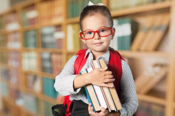 cute little girl with  books - Valokuva, kuva