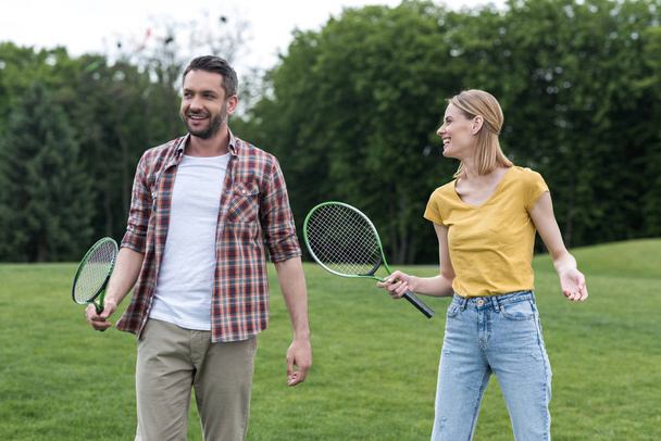 couple with badminton racquets - Photo, Image