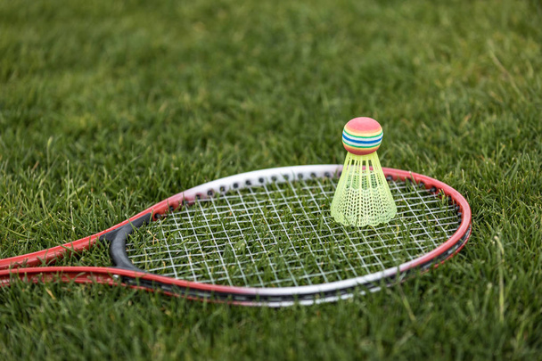 shuttlecock on badminton racket  - Foto, afbeelding