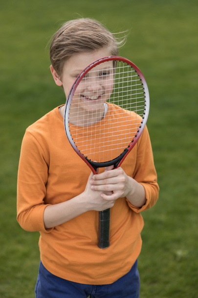 Boy with badminton racquet  - Φωτογραφία, εικόνα