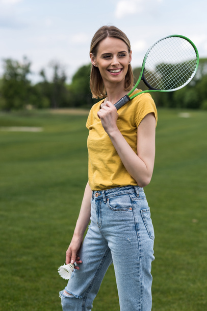 woman with badminton racquet and shuttlecock  - Fotó, kép