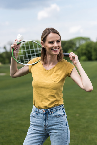 woman with badminton racquet and shuttlecock  - 写真・画像