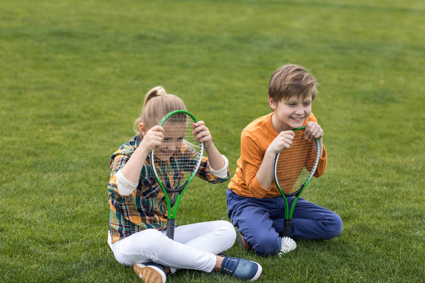 little kids with badminton equipment - Fotó, kép
