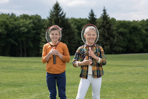 Kids with badminton racquets  - 写真・画像