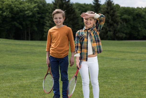 Kids with badminton racquets  - Foto, imagen