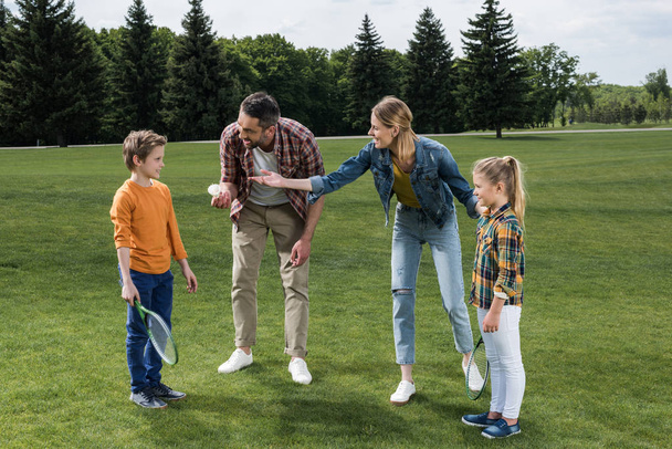 parents playing badminton with kids - Photo, Image