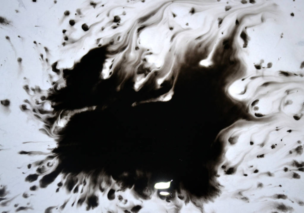 Black Ink Conveyed Over White Close-up Paper. - Foto, afbeelding