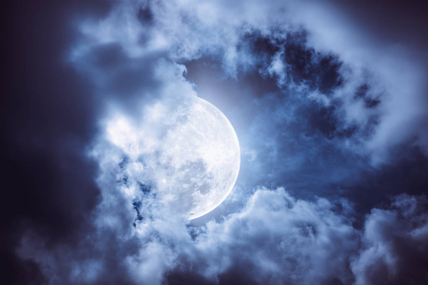 Nighttime sky with cloudy and bright full moon, nature background. - Photo, Image