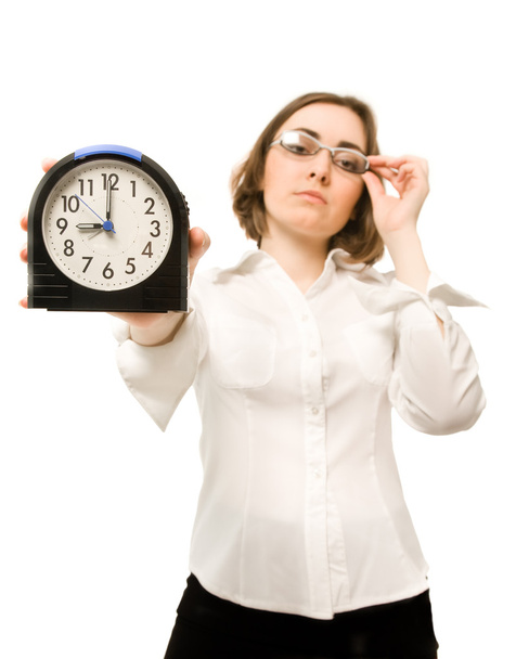 Businesswoman with alarm clock (focus on clock) - Valokuva, kuva