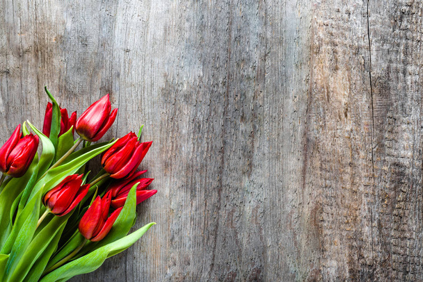 Red tulips, bouquet of flowers, spring background or mothers day card - Fotografie, Obrázek