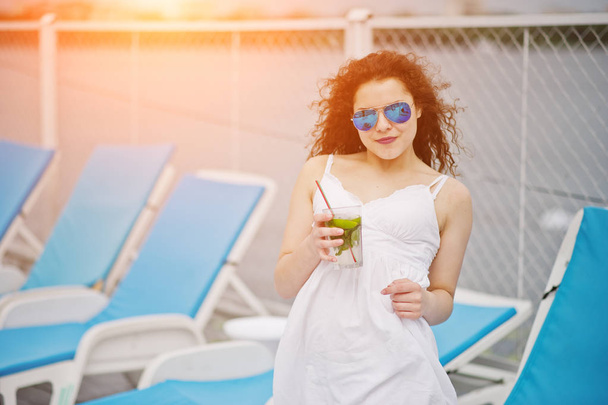 Portrait of an amazing young girl wearing sunglasses enjoying he - Valokuva, kuva