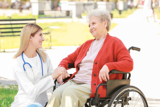 nurse and disabled elderly woman  - Foto, Bild