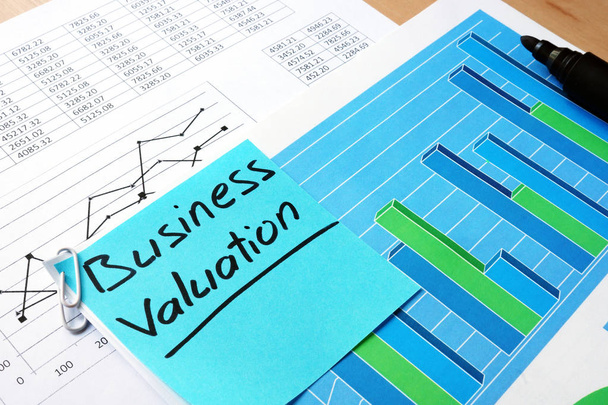 Piece of paper with words business valuation and financial data. - Foto, Imagen