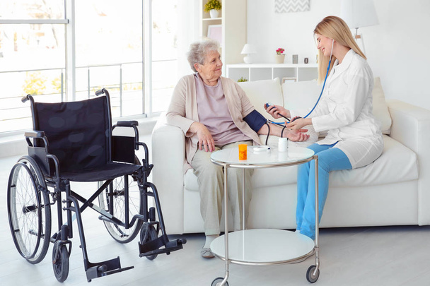 elderly woman in wheelchair - Photo, image