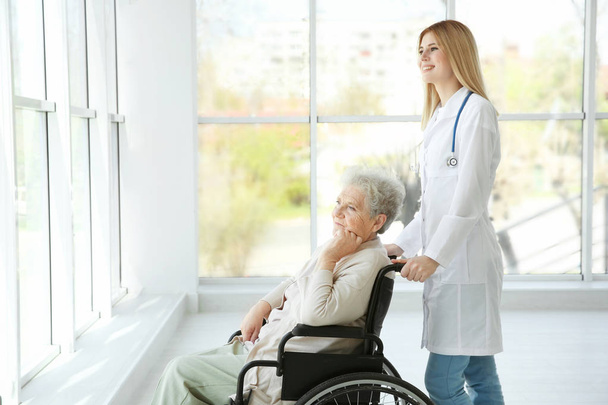 nurse and disabled elderly woman  - 写真・画像