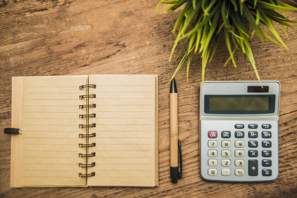 notebook, calculator, pen,  plant - Φωτογραφία, εικόνα