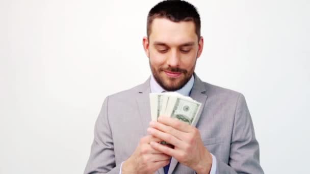 happy businessman with lot of dollar money - Záběry, video