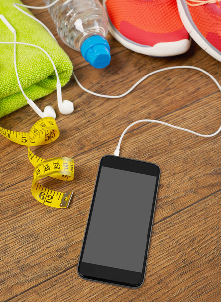 Telefon komórkowy i sprzętu sportowego - Zdjęcie, obraz