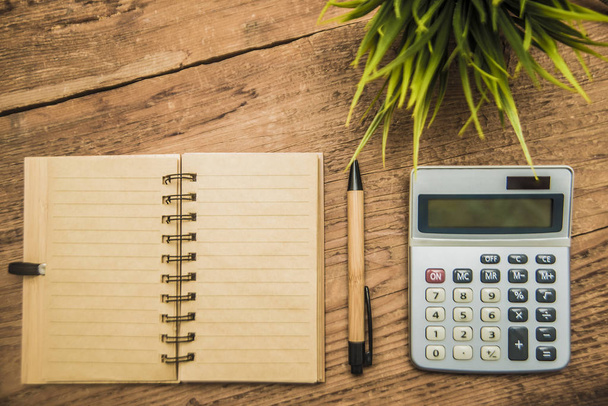 notebook, calculator, pen,  plant - Φωτογραφία, εικόνα