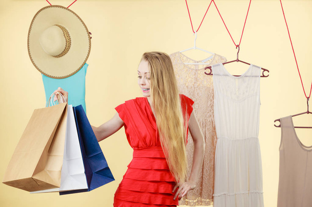 Woman in shop picking clothes, sale concept - Foto, Bild