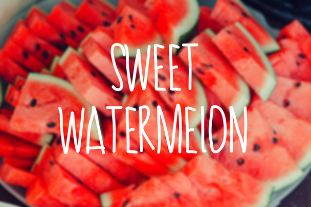 Slices of fresh ripe red watermelons blur background. - Photo, Image