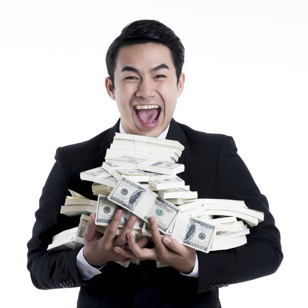 Close up the young man happy and carrying a large pile of bankno - 写真・画像