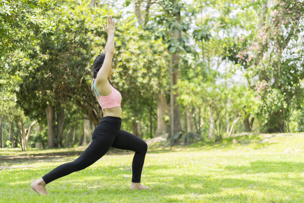 beautiful woman relax yoga in the park - Photo, Image