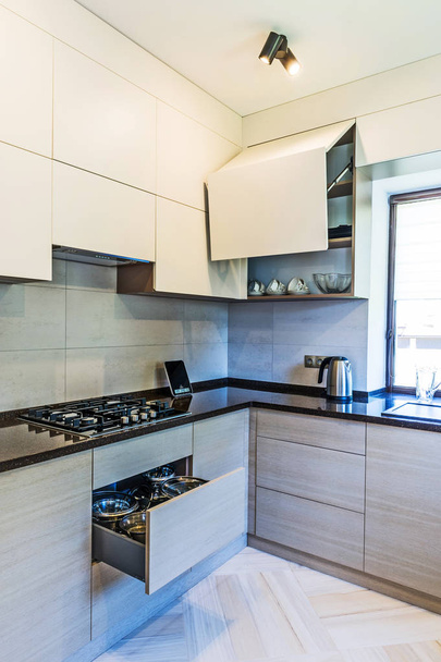 modern kitchen interior with white walls and wooden floor.  - Фото, изображение