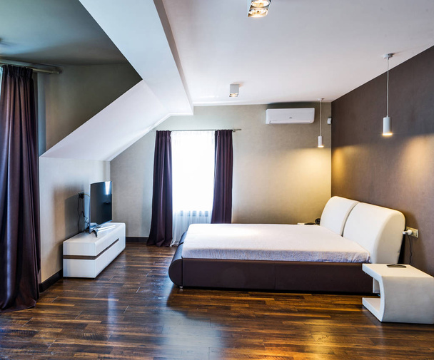 interior of a hotel room with a comfortable bed  - Фото, изображение