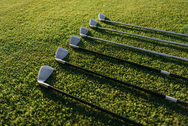 Golf clubs on grass - 写真・画像