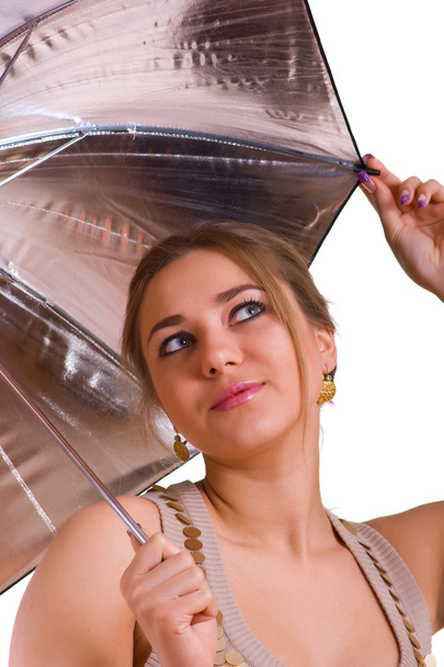 Women in golden dress with umbrella - Фото, изображение