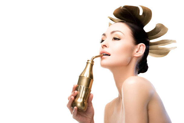woman with golden water bottle - Photo, Image